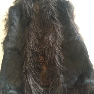 Fur and Tibetan Lamb trimmed, reversible vest.